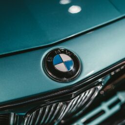 green bmw car in close up photography